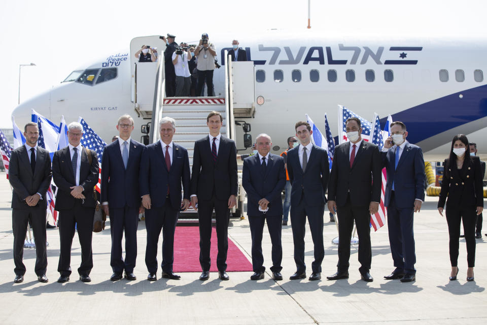 U.S. President Donald Trump’s senior adviser and son-in-law Jared Kushner, center, national security adviser Robert O’Brien, fourth left, and Israeli and American delegations pose for a photo before their departure to Abu Dhabi, at Ben-Gurion Airport, in Lod, near Tel Aviv, Israel, Monday, Aug. 31, 2020. (Heidi Levine/Pool via AP).