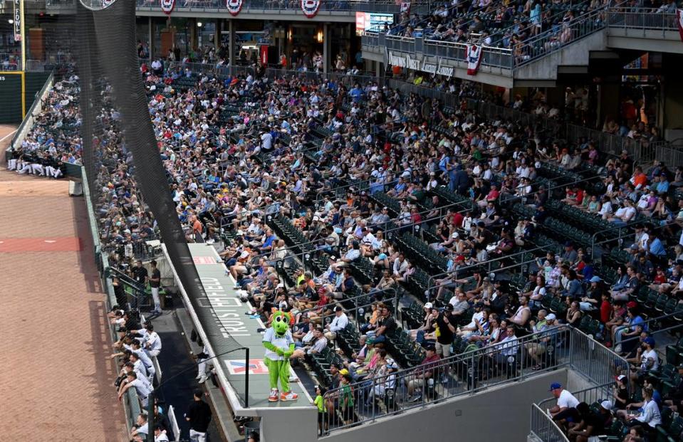 Charlotte Knights mascot Homer entertains the fans from atop the team’s dugout roof at Truist Field on Tuesday, April 2, 2024. The Charlotte Knights hosted the Norfolk Tides in their 2024 home opener,