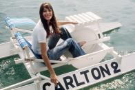<p>Jane Birkin dresses casually in a white T-shirt and jeans for a day on a pedal boat in 1974. </p>