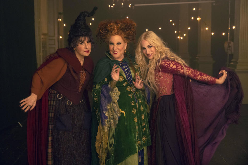 This image released by Disney shows, from left, Kathy Najimy as Mary Sanderson, Bette Midler as Winifred Sanderson, and Sarah Jessica Parker as Sarah Sanderson in "Hocus Pocus 2." (Matt Kennedy/Disney via AP)