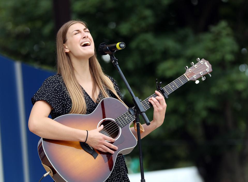 Grace Kiple, 21, of Sergeant Bluff performs a vocal and guitar solo in the Senior division during the 62nd Bill Riley Talent Search finals on the Anne and Bill Riley Stage at the Iowa State Fair on Sunday, August 21, 2022, in Des Moines.