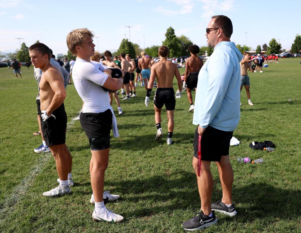 Isaac Wilson talks with his dad Mike Wilson during a 7-on-7 passing league game in Layton on Friday, June 9, 2023. | Scott G Winterton, Deseret News