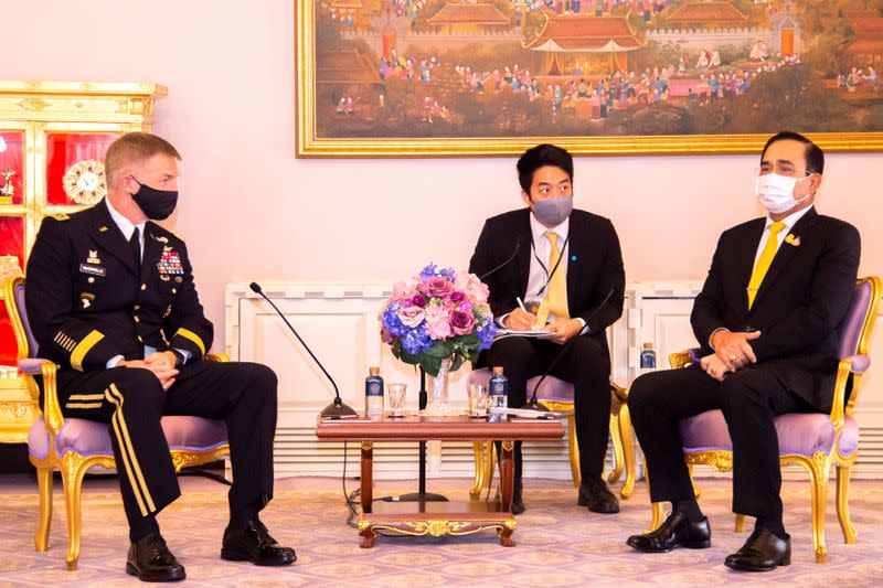 U.S. Army Chief of Staff General McConville and Thailand's PM Prayuth Chan-ocha pose during their meeting at Government House in Bangkok