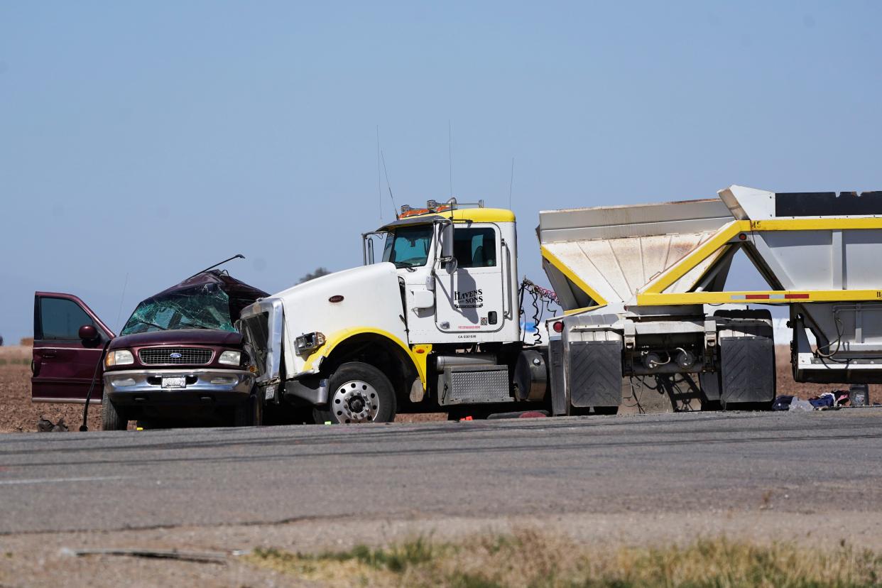 Law enforcement officers work at the scene of a deadly crash in Holtville, Calif. on Tuesday, March 2, 2021.