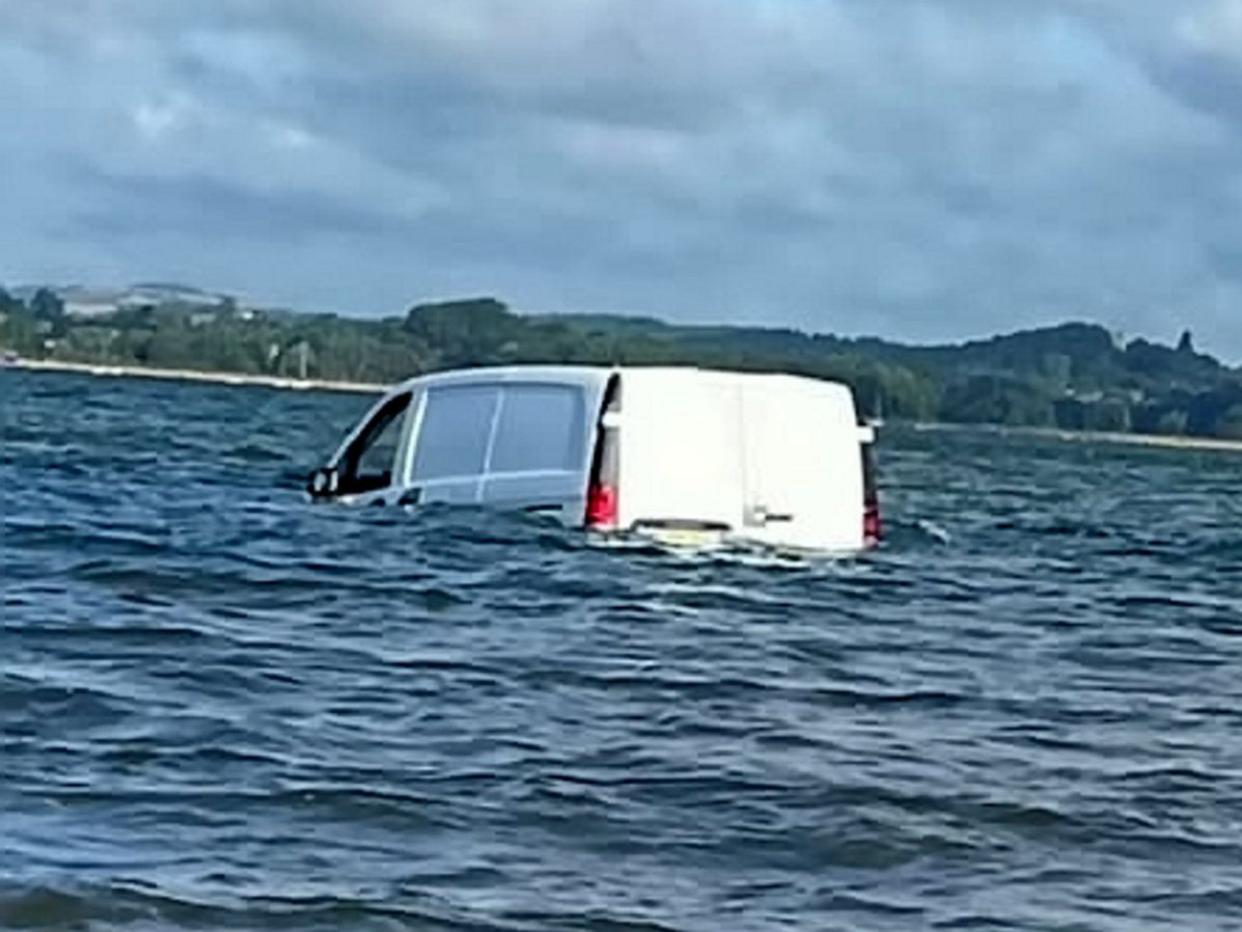 The vehicle was seen floating off Exmouth, Devon. (SWNS)