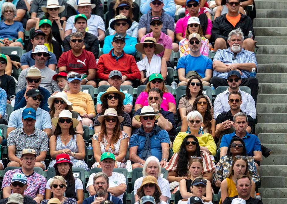 Tennis fans watch Elena Rybakina of Kazakhstan play Aryna Sabalenka of Belarus in the women's singles final of the BNP Paribas Open at the Indian Wells Tennis Garden in Indian Wells, Calif., Sunday, March 19, 2023. 