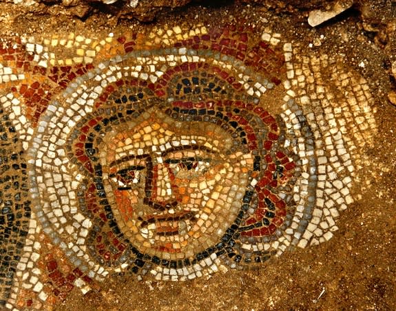 A female face depicted in mosaic on an ancient Jewish synagoge. Archaeologists uncovered this high-quality artwork in June 2012.