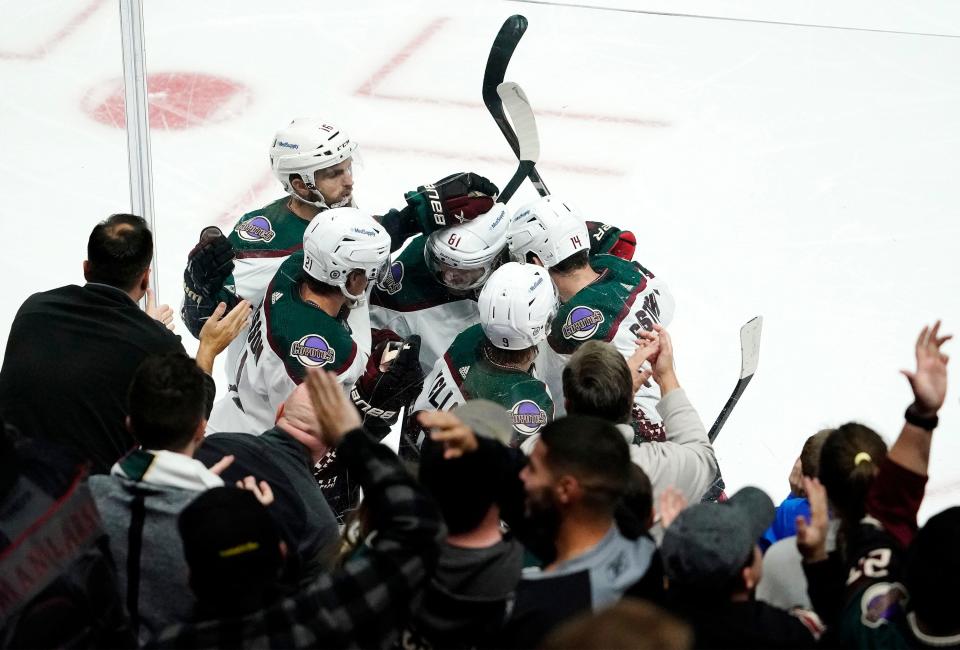Oct 18, 2021; Glendale, Arizona, USA; Arizona Coyotes right wing Clayton Keller (9) celebrates with his teammates after scoring a goal against the St. Louis Blues in the first period at Gila River Arena. Mandatory Credit: Rob Schumacher-Arizona Republic