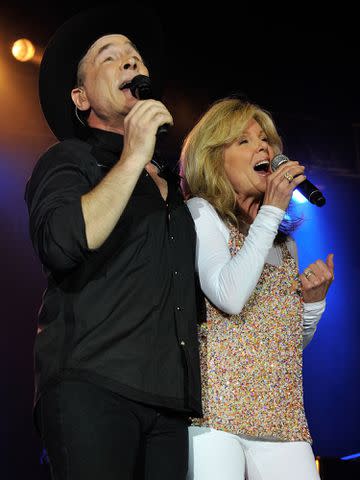 <p>Frederick Breedon IV/Getty</p> Clint Black performs a duet with his wife Lisa Hartman Black during the 2nd annual Music City Gives Back Concert on June 5, 2012 in Nashville, Tennessee.