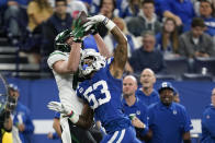 New York Jets' Tyler Kroft (81) makes a catch against Indianapolis Colts' Darius Leonard (53) during the first half of an NFL football game, Thursday, Nov. 4, 2021, in Indianapolis. (AP Photo/Michael Conroy)