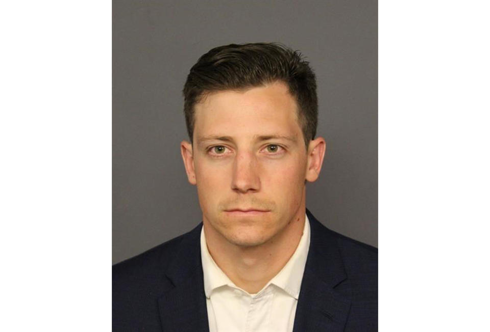 FILE - This undated file photo provided by the Denver Police Department shows Chase Bishop, an FBI agent who accidentally shot a man in the leg while dancing at a Denver nightspot on June 12, 2018. Bishop pleaded not guilty to second-degree assault in the case on Thursday, Nov. 8, 2018, but a plea deal is still possible in the case. (Denver Police Department via AP, File)