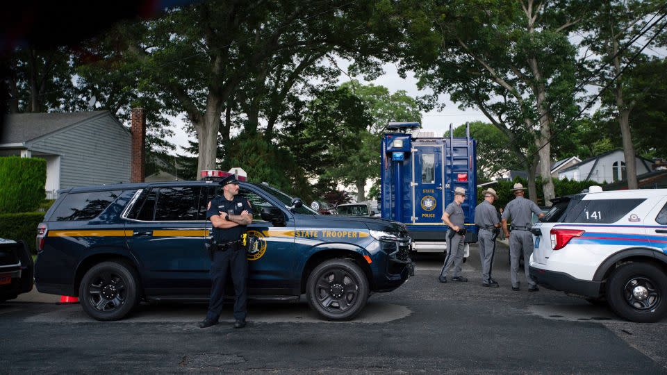 Law enforcement arrive at a house Friday, July 14, 2023, as sources said a suspect has been taken into custody in connection with a string of killings on New York's Long Island. - Eduardo Munoz Alvarez/AP