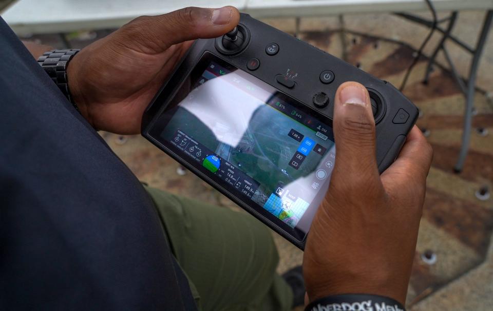 State Trooper Damien Maddox uses a controller to navigate one of the department's drones.