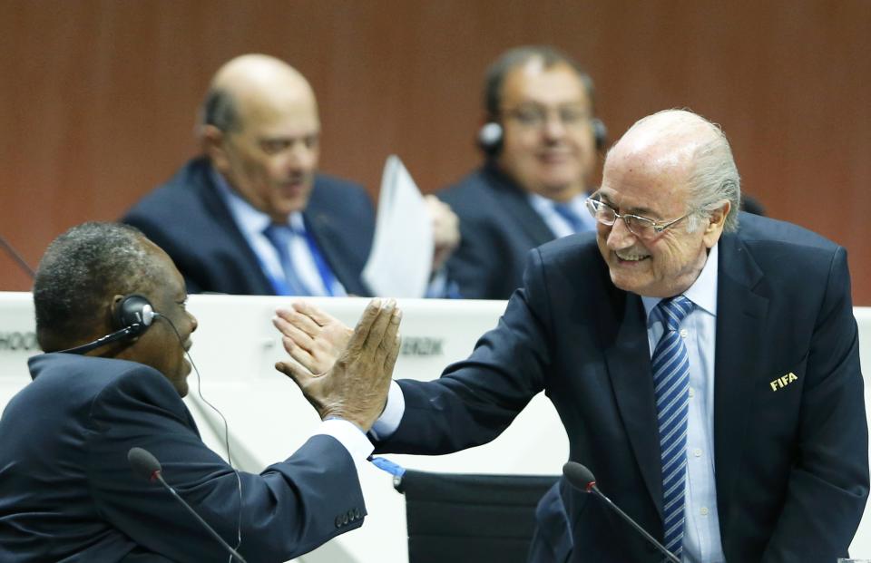 FIFA President Blatter and Hayatou, Senior Vice President of the FIFA do a Handshake For Peace at the 65th FIFA Congress in Zurich