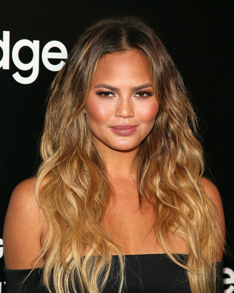 <p> Chrissy and her glossy tousled waves have always suited her well&#x2014;it&apos;s one of her signature styles on the red carpet. Adding gradual highlights adds dimension to your waves. </p> <p> Celeb stylist Jen Atkin shares her trick for this tousled look: &quot;One of my favorite tricks for styling hair is &#x2018;the clip trick,&quot; Atkin explains. &quot;This is an easy, no-fuss way to get incredible natural-looking waves. Spray damp hair generously with wave spray then use duck bill clips to create a dent in the hair, pushing the hair up at the root, then clipping into place, pushing the hair up underneath it, and clipping into place until the entire head has been clipped and the hair is in an S-pattern. Let your hair air dry or blow-dry over the clips. Then, remove the clips, scrunch and you&#x2019;ve got beach waves.&quot; </p>