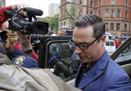 Carl Pistorius, the brother of Oscar Pistorius, arrives at the high court in Pretoria, South Africa, Monday, March 3, 2014. Oscar Pistorius is charged with murder with premeditation in the shooting death of girlfriend Reeva Steenkamp in the pre-dawn hours of Valentine's Day 2013. (AP Photo/Schalk van Zuydam)