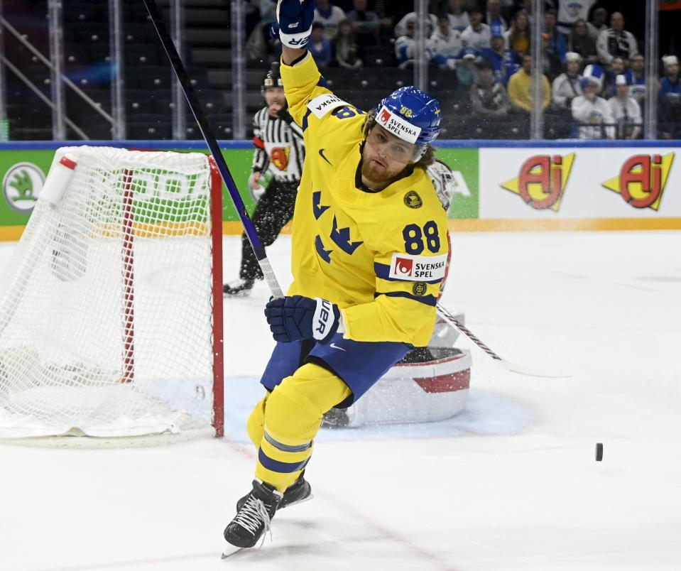 William Nylander of Sweden celebrates scoring during the Hockey World Championship quarterfinal match between Sweden and Canada in Tampere, Finland, Thursday, May 26, 2022. (Vesa Moilanen/Lehtikuva via AP)