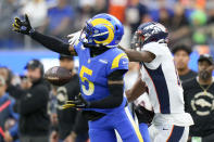 Los Angeles Rams cornerback Jalen Ramsey breaks up a pass intended for Denver Broncos wide receiver Montrell Washington during the first half of an NFL football game between the Los Angeles Rams and the Denver Broncos on Sunday, Dec. 25, 2022, in Inglewood, Calif. (AP Photo/Jae C. Hong)