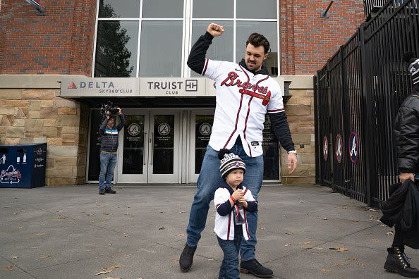 ATLANTA, GA - NOVEMBER 05: Fans cheer for Adam Duvall of the Atlanta Braves as he gets on the buses before their World Series Parade at Truist Park on November 5, 2021 in Atlanta, Georgia. The Atlanta Braves won the World Series in six games against the Houston Astros winning their first championship since 1995. (Photo by Megan Varner/Getty Images)