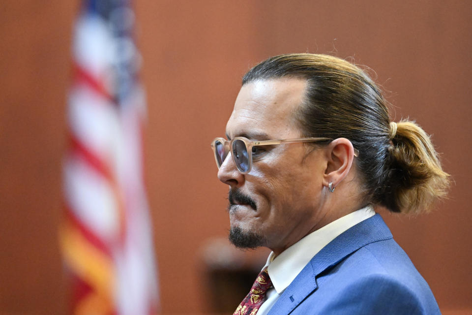 Actor Johnny Depp looks on in the courtroom at the Fairfax County Circuit Courthouse in Fairfax, Va., Tuesday, May 24, 2022. Depp sued his ex-wife Amber Heard for libel in Fairfax County Circuit Court after she wrote an op-ed piece in The Washington Post in 2018 referring to herself as a "public figure representing domestic abuse." (Jim Watson/Pool photo via AP)