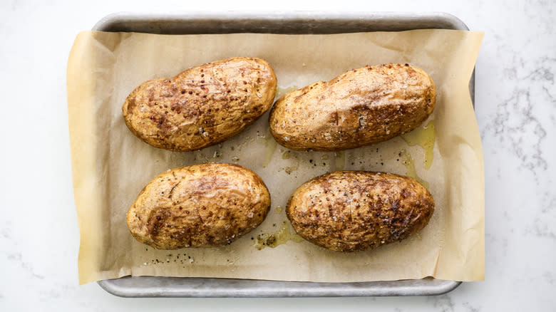 baked potatoes on tray