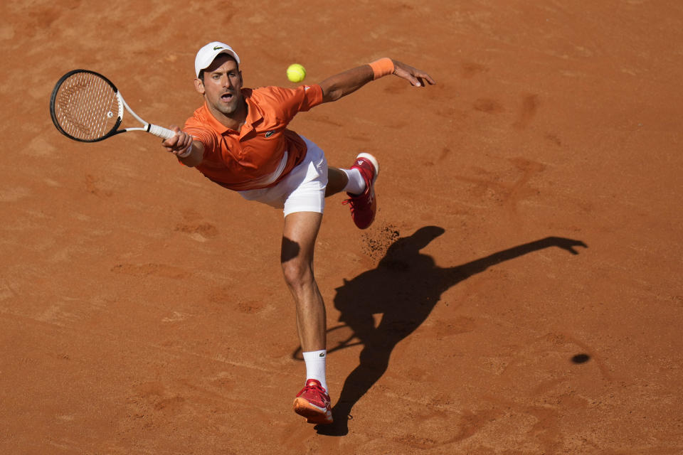 Serbia's Novak Djokovic returns the ball to Greece's Stefanos Tsitsipas during their final match at the Italian Open tennis tournament, in Rome, Sunday, May 15, 2022. (AP Photo/Alessandra Tarantino)