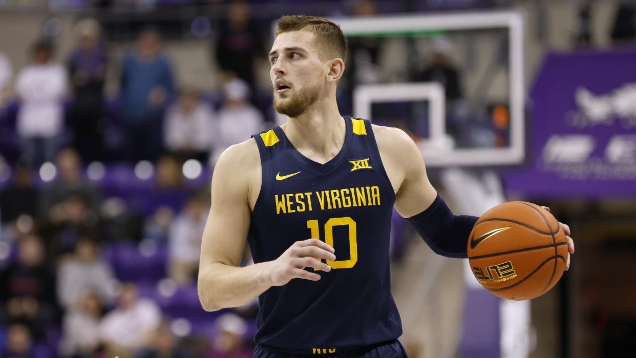 West Virginia guard Erik Stevenson (10) advances the ball against TCU in the second half of an NCAA college basketball game, Tuesday, Jan. 31, 2023, in Fort Worth, Texas. (AP Photo/Ron Jenkins)