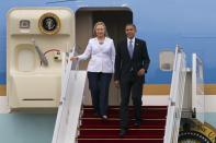 YANGON, MYANMAR - NOVEMBER 19: US President Barack Obama and Secretary of State Hilary Clinton arrive at Yangon International airport during his historical first visit to the country on November 19, 2012 in Yangon, Myanmar. Obama is the first US President to visit Myanmar while on a four-day tour of Southeast Asia that also includes Thailand and Cambodia. (Photo by Paula Bronstein/Getty Images)