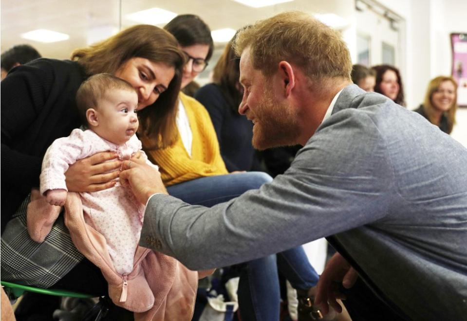Prince Harry Bonds with Baby at YMCA Visit