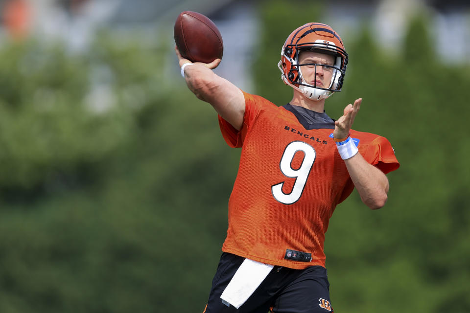 Cincinnati Bengals' Joe Burrow throws a pass during an NFL football practice in Cincinnati, Wednesday, July 28, 2021. (AP Photo/Aaron Doster)