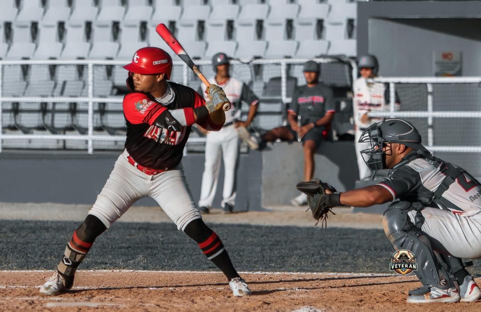 Former Durfee baseball player and Cocoteros de Loiza battter Josh Boria swings at a pitch during a Double A baseball game in San Juan, Puerto Rico.