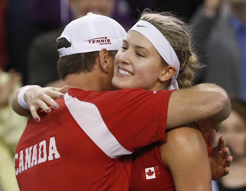 Canada's Eugenie Bouchard hugs captain Sylvain Bruneau after defeating Slovakia's Jana Cepelova during their Fed Cup tennis match at the PEPS stadium at Laval University in Quebec City, April 20, 2014. REUTERS/Mathieu Belanger)