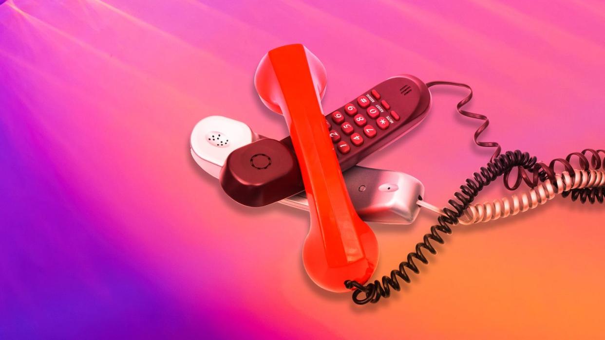 a red telephone with a cord