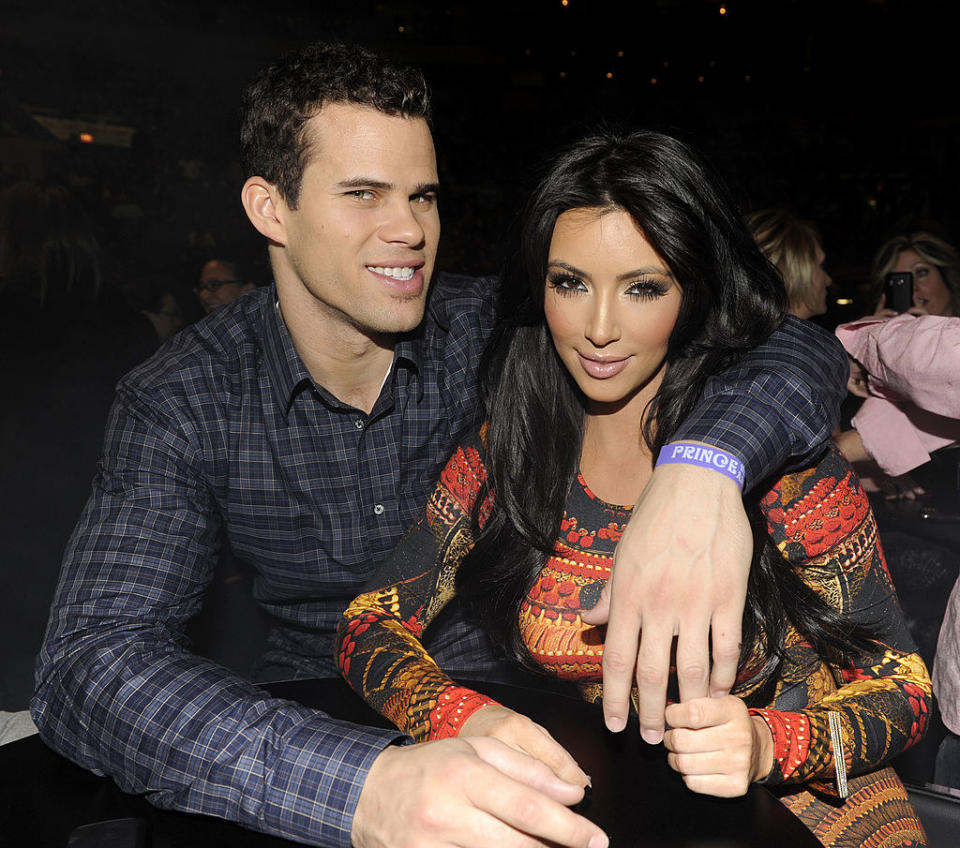 Kris Humphries and Kim Kardashian watch Prince perform during his "Welcome 2 America" tour