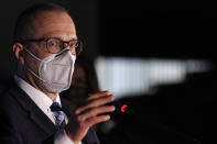 World Health organization Director for Europe Hans Kluge speaks to media during a press conference where he said he would take an AstraZeneca vaccine when his turn comes for inoculation, at a vaccination center in Bucharest, Romania, Wednesday, April 7, 2021. British authorities recommended Wednesday that the AstraZeneca COVID-19 vaccine not be given to adults under 30 where possible because of strengthening evidence that the shot may be linked to rare blood clots, a recommendation that came as regulators both in the United Kingdom and the European Union emphasized that the benefits of receiving the vaccine continue to outweigh the risks for most people — even though the European Medicines Agency said it had found a "possible link" between the shot and the rare clots.(AP Photo/Andreea ALexandru)