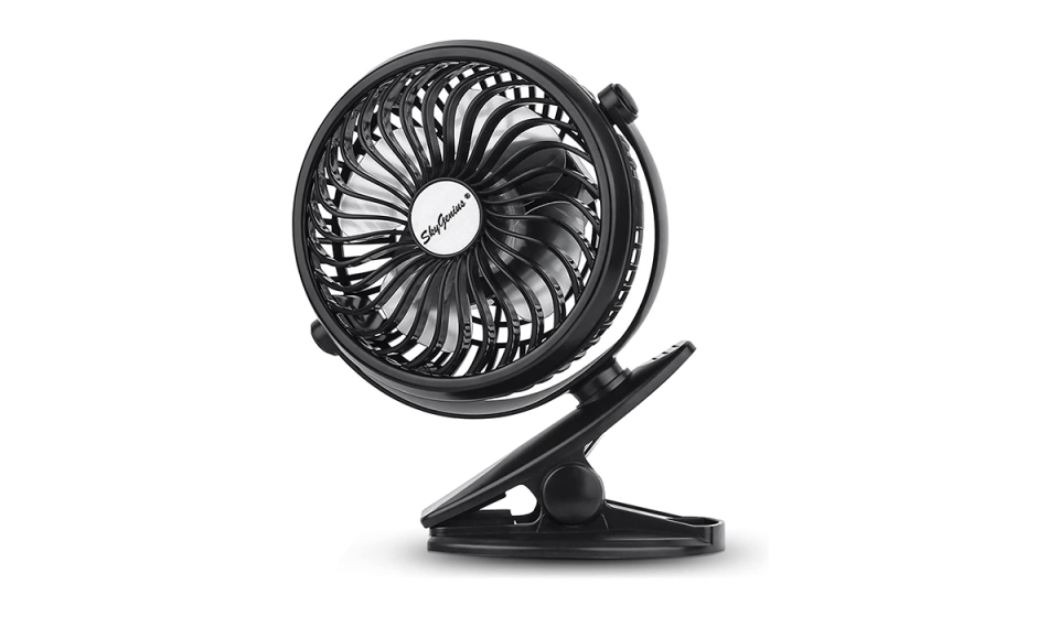 Black fan with large clip at base.