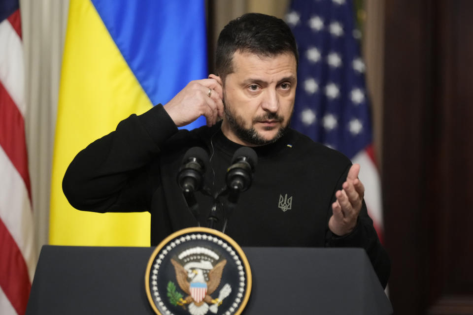 FILE - Ukrainian President Volodymyr Zelenskyy speaks at a news conference with U.S. President Joe Biden in the Indian Treaty Room in the Eisenhower Executive Office Building near the White House, Tuesday, Dec. 12, 2023, in Washington. An aid package for Ukraine has stalled in the U.S. Congress as Republicans insist on linking any more money to U.S.-Mexico border security changes. (AP Photo/Andrew Harnik, File)