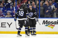 Tampa Bay Lightning center Anthony Cirelli (71) celebrates his goal against the New York Islanders with left wing Brandon Hagel (38) during the first period of an NHL hockey game Saturday, March 30, 2024, in Tampa, Fla. (AP Photo/Chris O'Meara)