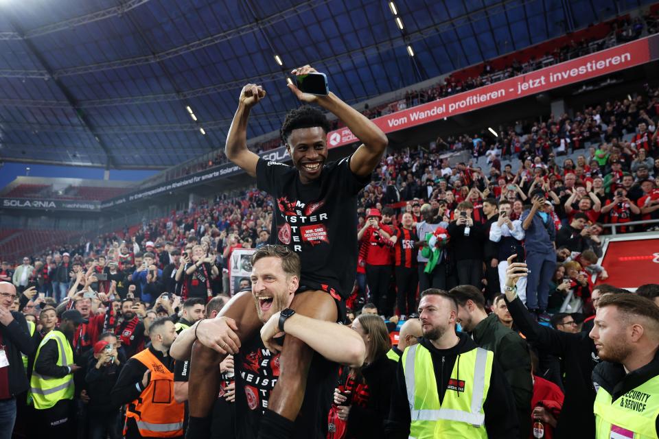 Nathan Tella celebrates after Bayer Leverkusen won the Bundesliga title for the first time in their history.