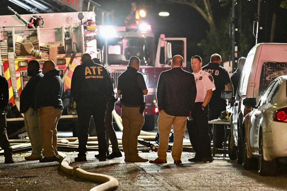 First responders work the scene after a deadly fire on Thursday, Oct. 19, 2023, in Baltimore. (Jerry Jackson/The Baltimore Sun via AP)