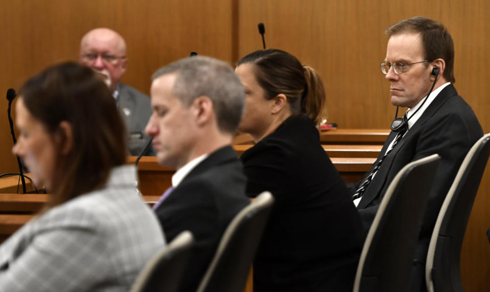 Mark Jensen, right, sits with his legal team as the state gives its opening statement during his trial at the Kenosha County Courthouse on Wednesday, Jan. 11, 2023, in Kenosha, Wis. The Wisconsin Supreme Court ruled in 2021 that Jensen deserved a new trial in the 1998 death of his wife Julie Jensen, who was poisoned with antifreeze. (Sean Krajacic/The Kenosha News via AP, Pool)