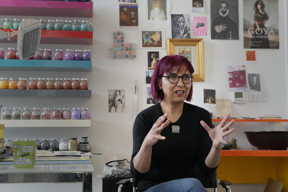 Artist Soheila Sokhanvari is interviewed in her studio at Wysing Arts Centre near Cambridge, England, Wednesday, Aug. 30, 2023. Soheila Sokhanvari is an Iranian-born artist whose latest work paid homage to the pre-1979 revolutionary feminists in Iran. Since the death of Mahsa Amini in September 2022, Iranians worldwide have taken to the street as an act of resistance against the Islamic Republic. Marking the one year anniversary of Amini's death, which has been a potent symbol of resistance, three prominent Iranian women in the U.K. speak to AP on their fight for the future of Iran. (AP Photo/Kirsty Wigglesworth)