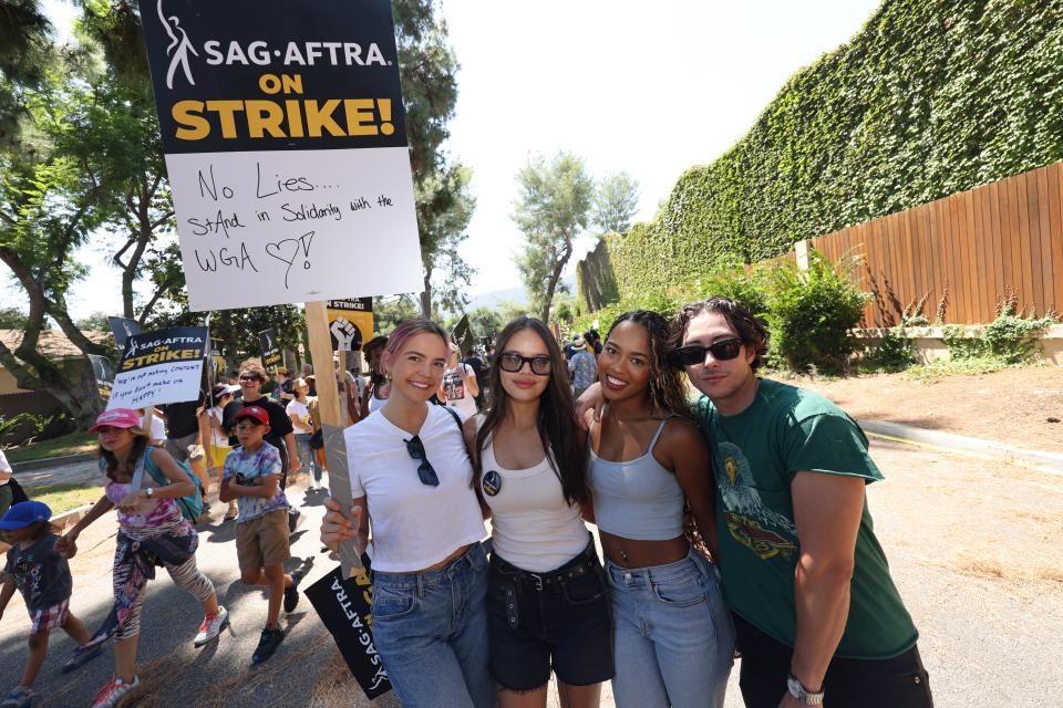 (L-R) Bailee Madison, Malia Pyles, Zaria, and Jordan Gonzalez attend the National Day of Solidarity rally outside Walt Disney Studios on August 22, 2023 in Burbank, California.