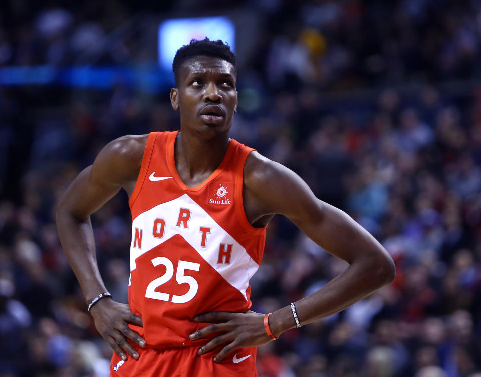 TORONTO, ON - JANUARY 17:  Chris Boucher #25 of the Toronto Raptors looks on during the second half of an NBA game against the Phoenix Suns at Scotiabank Arena on January 17, 2019 in Toronto, Canada.  NOTE TO USER: User expressly acknowledges and agrees that, by downloading and or using this photograph, User is consenting to the terms and conditions of the Getty Images License Agreement.  (Photo by Vaughn Ridley/Getty Images)