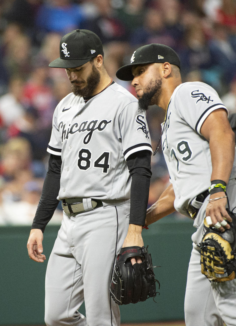 Chicago White Sox starting pitcher Dylan Cease (84) gets a pat from Jose Abreu after getting hit by a ball off the bat of Cleveland Indians' Bradley Zimmer during the sixth inning of a baseball game in Cleveland, Friday, Sept. 24, 2021. (AP Photo/Phil Long)