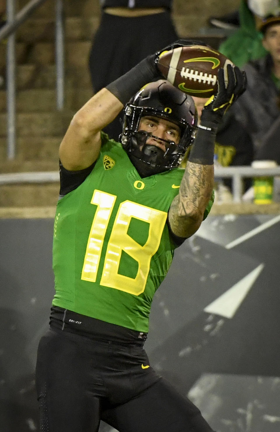 FILE - Oregon Ducks tight end Spencer Webb (18) hauls in a touchdown pass an NCAA college football game against Arizona on Sept. 25, 2021, in Eugene, Ore. Webb has died after falling and striking his head on rock slides at a popular swimming lake near Eugene, Oregon. Authorities say the 22-year-old was unresponsive when they arrived at Triangle Lake on Wednesday, July 13, 2022, and found him about 100 yards down a steep trail. (AP Photo/Andy Nelson, File)