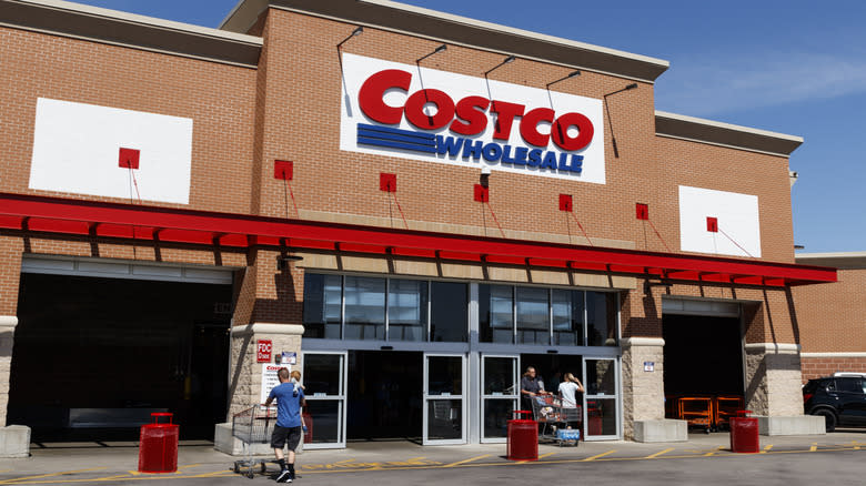 Customers entering Costco storefront