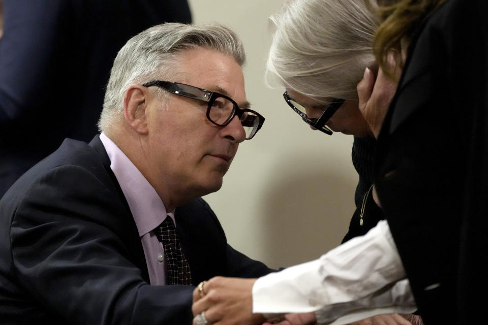 Actor Alec Baldwin speaks with sister Elizabeth Keuchler during a break in his hearing in Santa Fe County District Court, Wednesday, July 10, 2024, in Santa Fe, N.M. Baldwin is facing a single charge of involuntary manslaughter in the death of a cinematographer. (AP Photo/Ross D. Franklin, Pool)