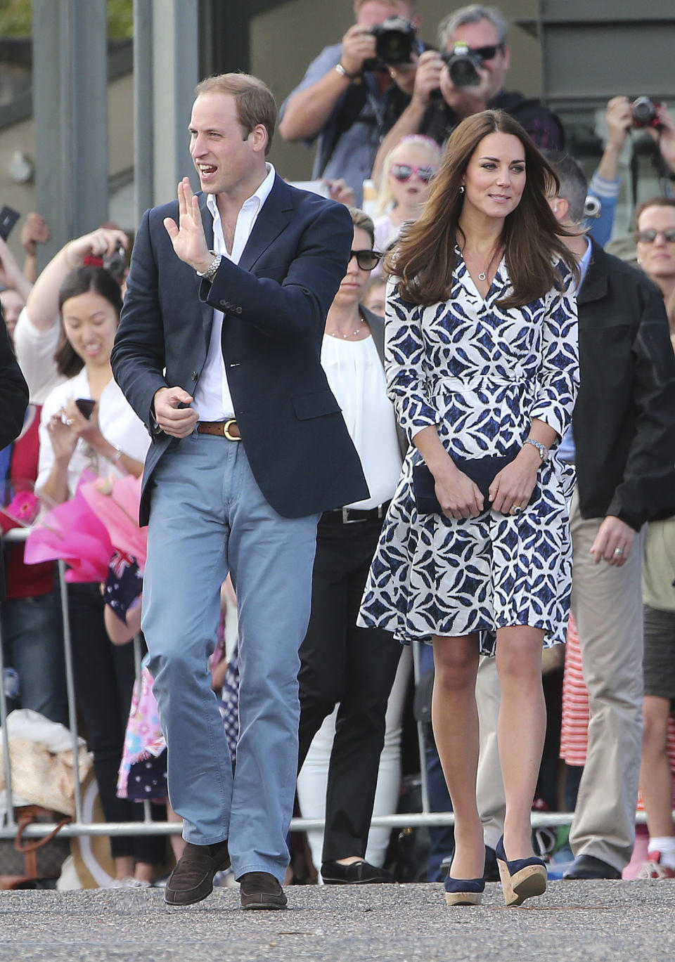 Britain's Prince William waves as he and his wife Kate, the Duchess of Cambridge, walk at Echo Point Lookout in Katoomba, Australia, Thursday, April 17, 2014. The Duke and Duchess of Cambridge on Thursday stopped in the Blue Mountains town of Winmalee to meet with firefighters and locals affected by last year's wildfires that destroyed more than 200 homes. (AP Photo/Rob Griffith)