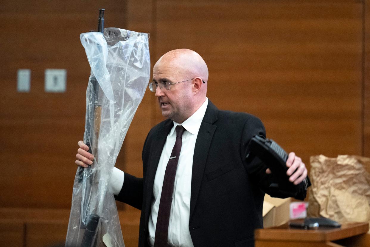 Franklin County Assistant Prosecutor David Zeyen on Thursday, Nov. 17, 2022 shows a county Common Pleas Court jury the rifle and magazines that 74-year-old Robert Thomas confronted Jason Keys, 43, with on Father's Day, June 20, 2021. Thomas was on trial for involuntary manslaughter and aggravated menacing, with prosecutors charging him with causing Key's death even though he didn't pull the trigger. A jury acquitted Thomas of involuntary manslaughter, but convicted him of aggravated menacing.